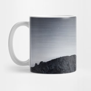 existence - man on barren rock at night Mug